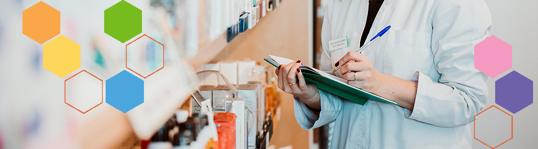 pharmacist with notebook and pen checking inventory