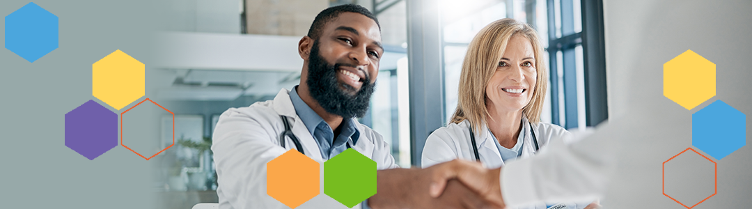 Male and female doctor greeting another doctor