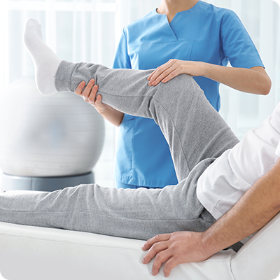 Orthopedic doctor holding patients leg