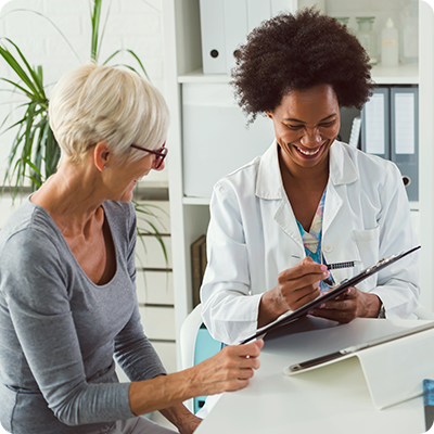 Female doctor going over test results with female patient