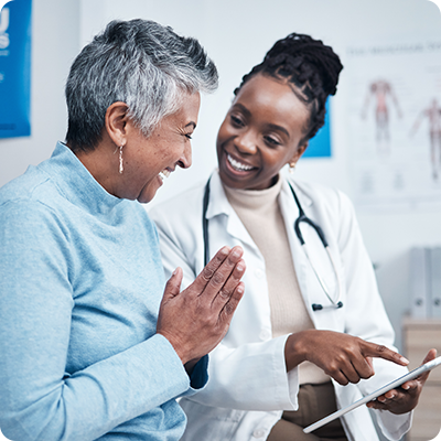 Female doctor showing elderly female patient results